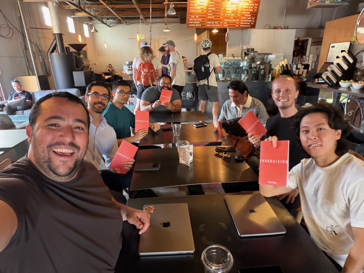 Founders gathered around a table at a workshop